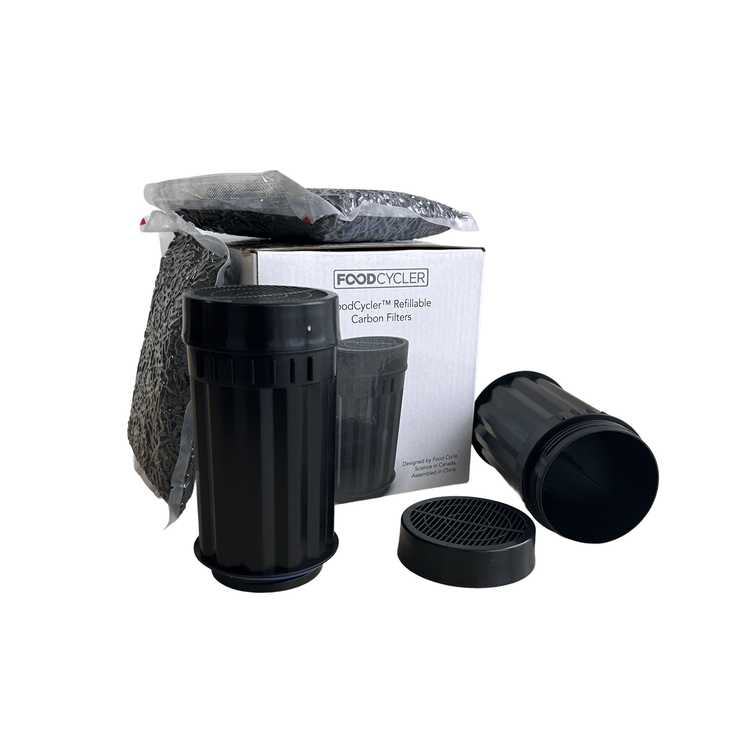 Black carbon filters with packaging labeled 'FoodCycler' on a white background