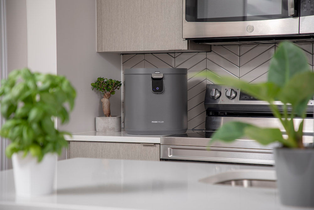 FoodCycler Eco 5 - Grey | on a kitchen counter next to a stove